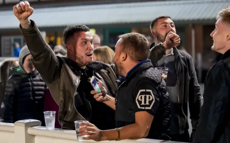 Race goers cheer at the trackside at Wolverhampton